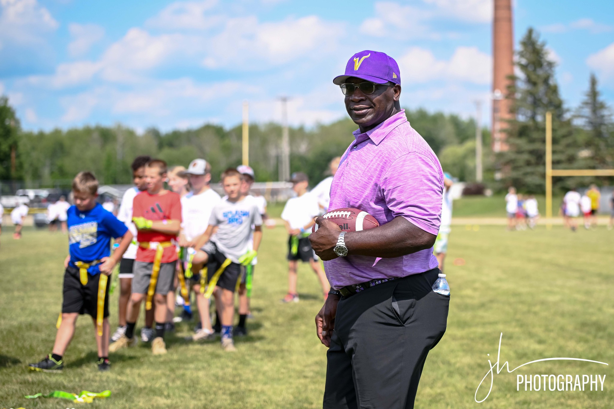 Coach demonstrating technique to athletes